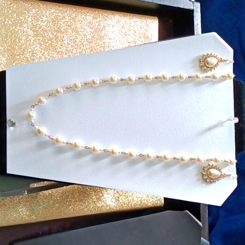 Girls with gold chain and diamond accents necklace along with earings matching